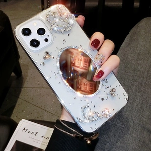 Luxury iPhone case featuring a rhinestone crown, mirror, and glitter Love design