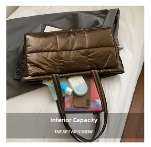 Macro detail of quilted tote bag interior showing large capacity for tablet and essentials