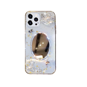 Luxury iPhone mirror case with gold foil, rhinestone crown, and Love heart decorations