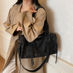 Retro punk style black Boston handbag with metal eyelets and strap details