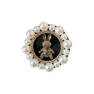 Elegant pearl and rhinestone phone grip with a 3D golden rabbit relief on black base