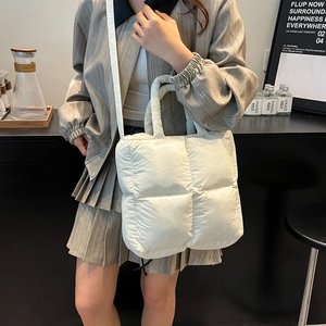 Chic white quilted puffer handbag for women with versatile shoulder strap and casual style
