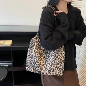 Retro leopard print canvas tote bag with brown leather straps and beaded tassel charm