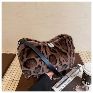 Close-up of leopard print faux fur shoulder bag featuring silver chain and metal zipper detail