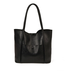 Black pebbled leather tote bag with long shoulder straps and magnetic buckle detail