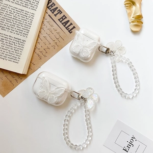 Transparent AirPods case with white lace butterfly decoration and pearl bead bracelet