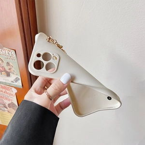 Detail of cream white iPhone case with gold chain showing flexible side protection