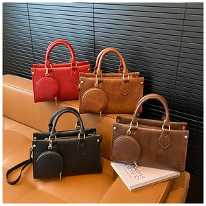 Detail of four textured PU leather handbags in multiple colors with matching coin purses