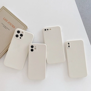 Flat lay of cream-colored minimalist liquid silicone iPhone cases on white background