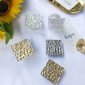 Square metallic phone sockets with hammered texture in gold and silver finishes