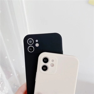 Close-up of black and off-white silicone phone cases with liquid texture and soft finish