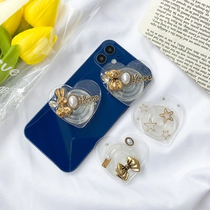 Foldable heart-shaped phone stands with rabbit, bear, and bowknot decorations
