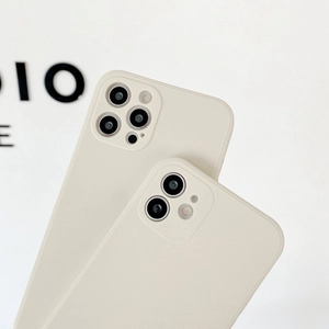 Detail view of liquid silicone phone cases with precise lens cutouts in creamy white