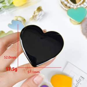Detailed size view of heart phone socket holder with gold trim and glossy finish