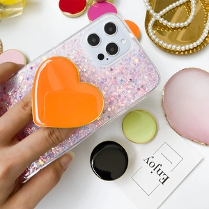Vibrant orange heart phone griptok on glitter case with diverse colorful stand options