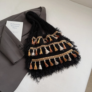 Bohemian black knitted tote bag with colorful tassels and golden woven fringe details