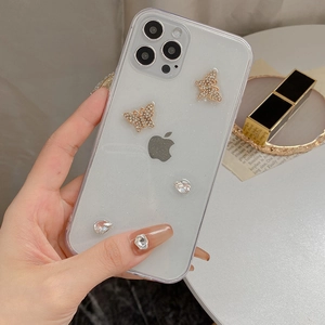 Detail of glitter iPhone case with 3D gold butterfly and rhinestones decoration