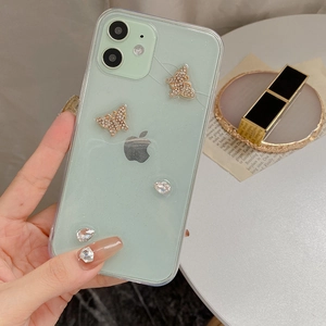 Close-up of mint green glitter phone case with gold crystal butterflies for iPhone