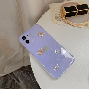 Detail of light purple glitter iPhone case featuring gold rhinestone butterfly accents