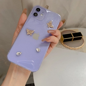 Detail view of purple glitter phone case featuring luxury rhinestone butterfly accents