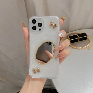 Glitzernde iPhone-Hülle mit Make-up-Spiegel und goldenen Metall-Schleifen-Details