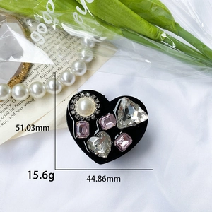 Black heart foldable phone socket with rhinestones and pearl on white fabric