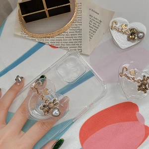 Detail of glitter heart phone grip with 3D bunny charm and Love text on transparent case