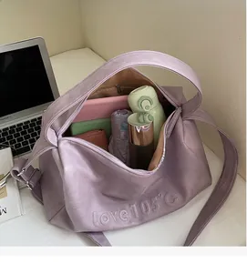 Large purple faux leather travel bag interior showing spacious capacity for daily items