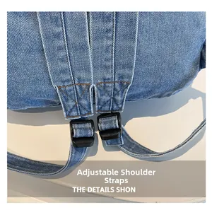 Macro detail of adjustable denim straps with black buckles on a light blue backpack