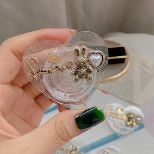 Handheld heart-shaped glitter phone grip with vintage gold rabbit and Love engraving