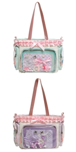 Close-up of cute school bags with lace ruffles, silk bows and transparent PVC panels