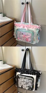 Detail of canvas Itabag with large PVC window, frills, and decorative ribbons for students