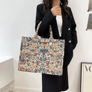 Floral embroidered canvas tote bag with jacquard pattern and round top handles