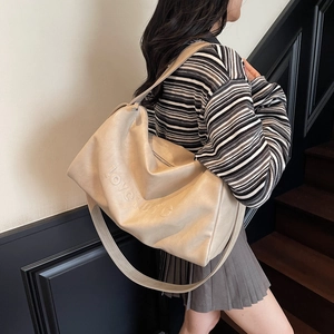 Large cream beige commuter tote bag with love 103°C embossing and matte leather finish