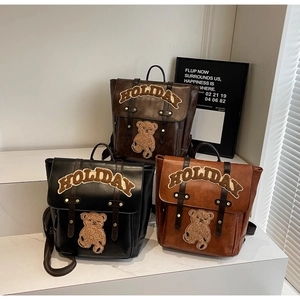 Three vintage PU leather backpacks in black and brown with cute teddy bear holiday patches