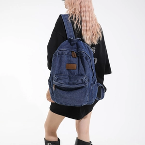 Vintage blue denim canvas backpack for men and women, casual school and travel rucksack.