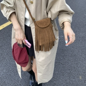 Brown tassel crossbody bag in suede finish with minimalist retro bohemian fringe style