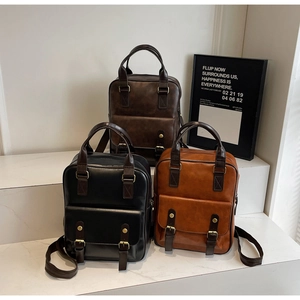 Detailed display of vintage faux leather backpacks in brown, black and caramel colors