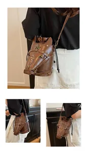 Close-up of horse-head bucket bag with vintage studs and adjustable shoulder strap