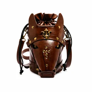 Detail of horse head shaped brown leather crossbody bag with vintage bronze metal rivets