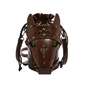 Detail of horse head shaped brown leather crossbody bag with vintage bronze metal rivets