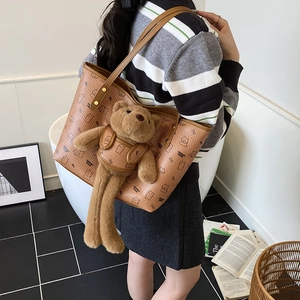 Brown PU leather tote bag with cartoon bear prints and a 3D plush teddy bear charm