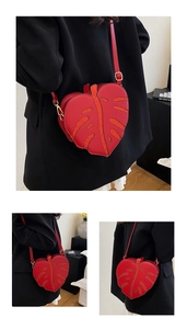 Macro detail of red leaf-shaped PU leather crossbody bag with glittery vein patterns