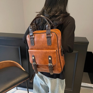 Brown vintage faux leather backpack for women with dual straps and front buckle pocket