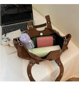 Top view of brown retro tote bag showing spacious interior with umbrella, phone and wallet