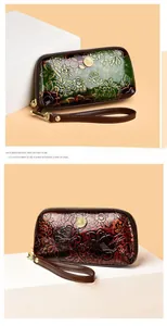 Detailed macro view of embossed floral patterns on retro gradient leather wristlet bags