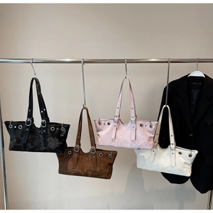 Group display of rivet leather tote bags in black, brown, pink and beige tones
