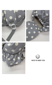 Detailed views of gray polka dot backpack with drawstring, magnetic buckle and ruffled pockets
