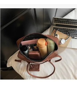 Top view of brown suede bowling bag interior showing high storage capacity for daily items