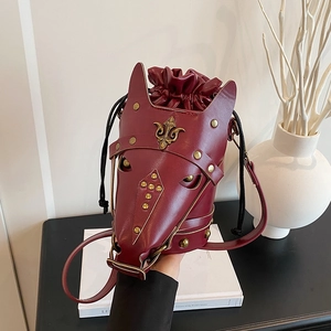 Vintage burgundy horse head shaped crossbody bucket bag with bronze studs and fleur-de-lis